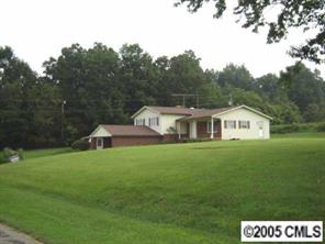 9637 Mull Road Vale, NC 28168 - Photo 1 of 4 a house with green field in front of it