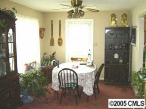 9637 Mull Road Vale, NC 28168 - Photo 2 of 4 a view of a dining room with furniture and chandelier