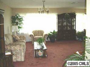 9637 Mull Road Vale, NC 28168 - Photo 3 of 4 a dining room with furniture and a chandelier