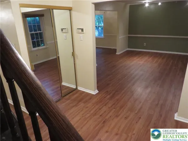 a view of entryway with wooden floor