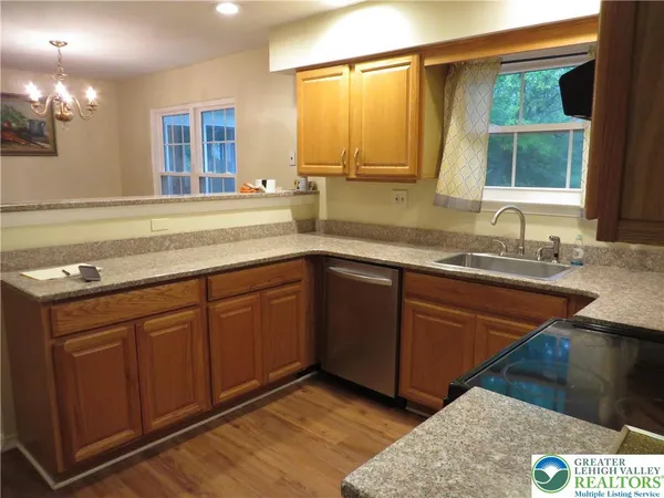 a kitchen with a sink and a window