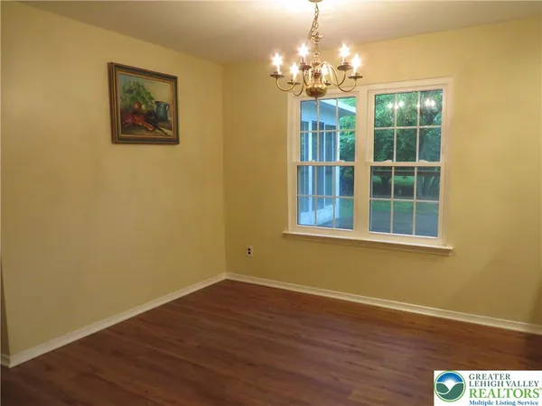 a view of livingroom with window and wooden floor