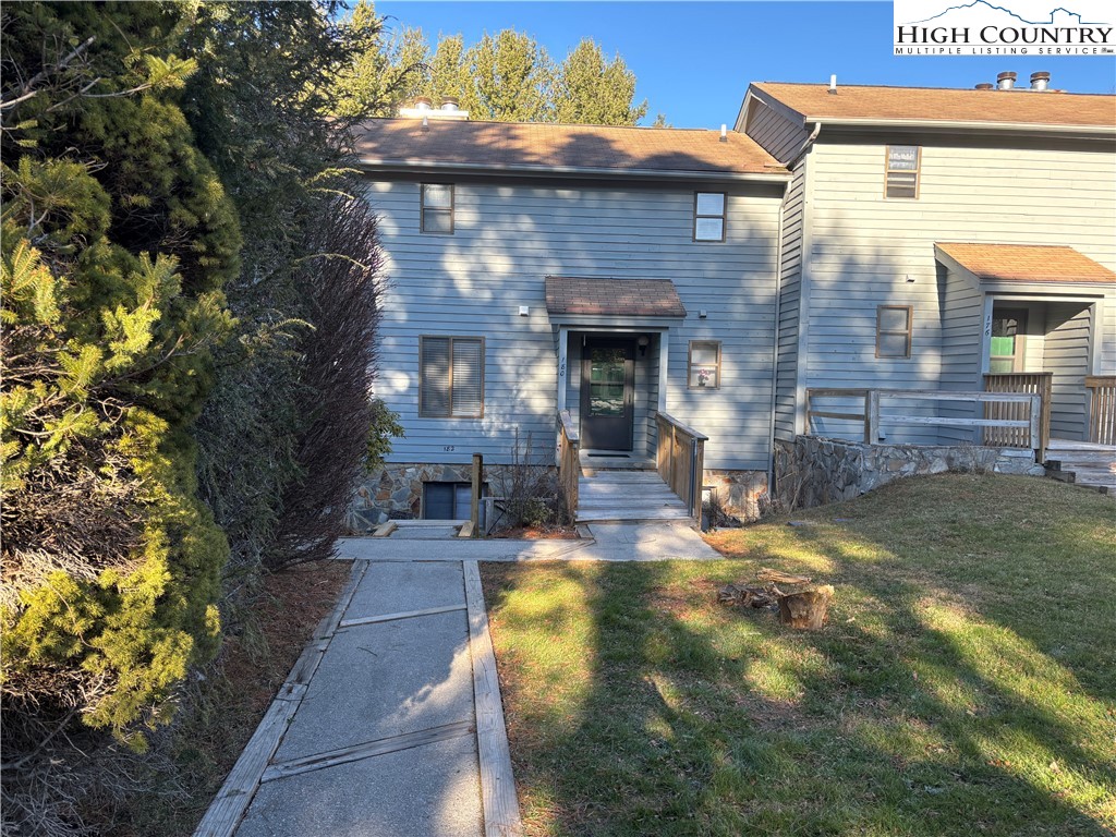 180 Village Drive, Unit 1C4 Boone, NC 28607 - Photo 1 of 23 a front view of a house with garden