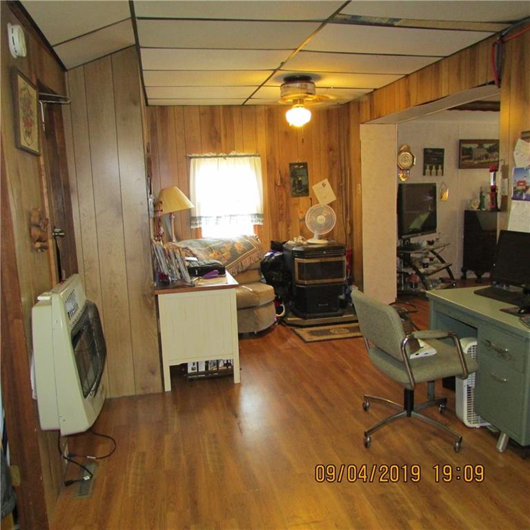 168 Gibson Hill Road Georgetown, PA 15043 - Photo 15 of 19 Family room with pellet stove and gas heater.