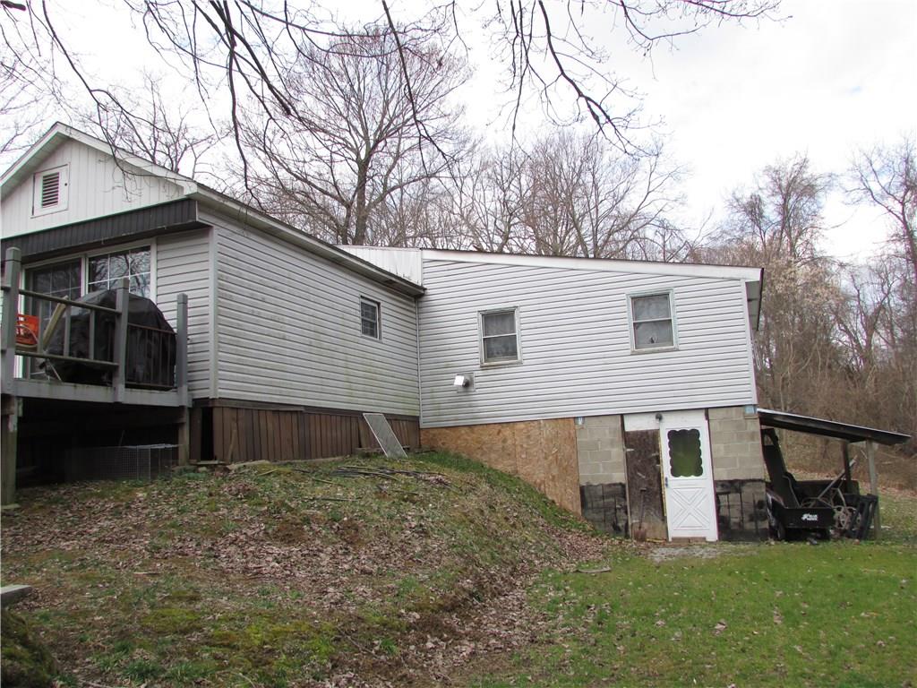 168 Gibson Hill Road Georgetown, PA 15043 - Photo 4 of 19 Right side of mobile with addition (2) room. Basement under addition.