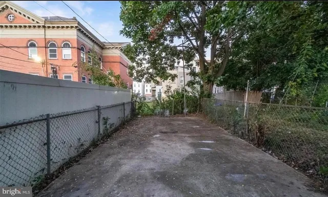 a view of a street with a trees