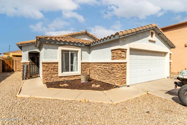 a front view of a house with a garage