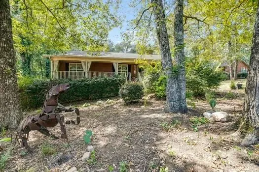 a view of a house with a yard and plants