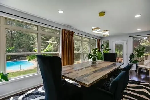 a bathroom with a sink a toilet and shower curtain