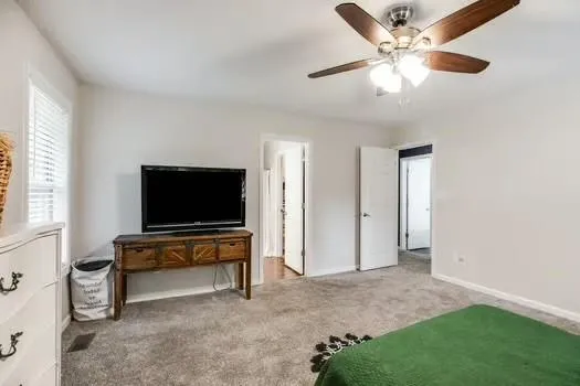 a bedroom with furniture and a fireplace