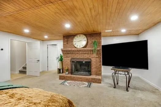a view of walk in closet with clothes