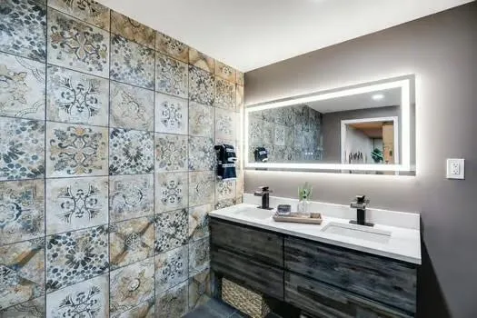 a view of a patio with table and chairs potted plants and large tree