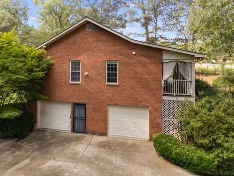 a view of a swimming pool with a yard