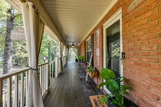 a porch with wooden floor