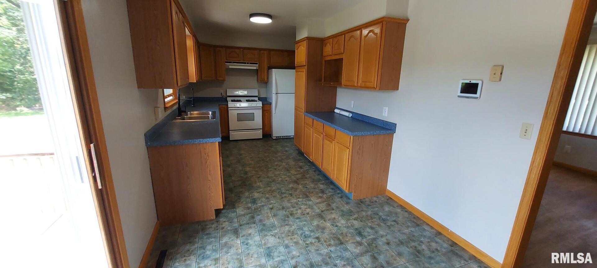 2390 Highway 150 Rio, IL 61472 - Photo 21 of 37 a view of a kitchen from the hallway