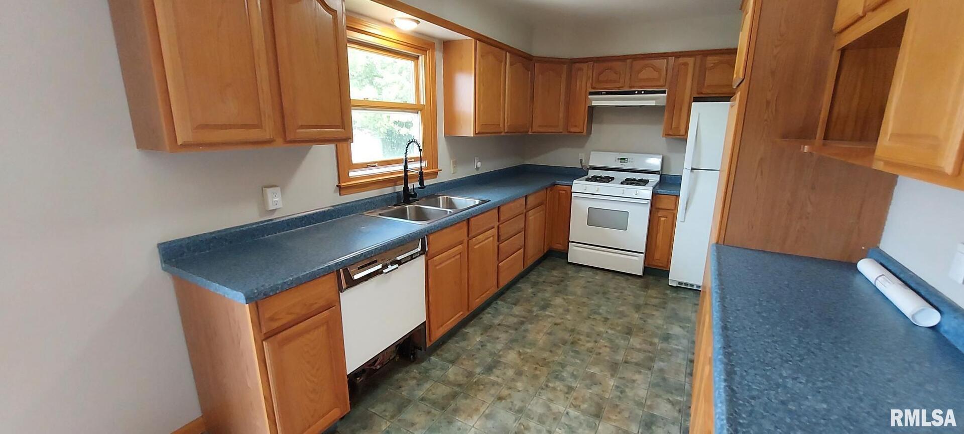 2390 Highway 150 Rio, IL 61472 - Photo 23 of 37 a kitchen with stainless steel appliances granite countertop a sink stove and refrigerator