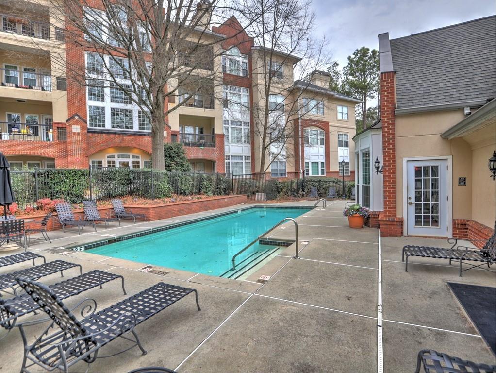 3636 Habersham Road Northwest, Unit 2308 Atlanta, GA 30305 - Photo 37 of 42 a view of a building with backyard and sitting area