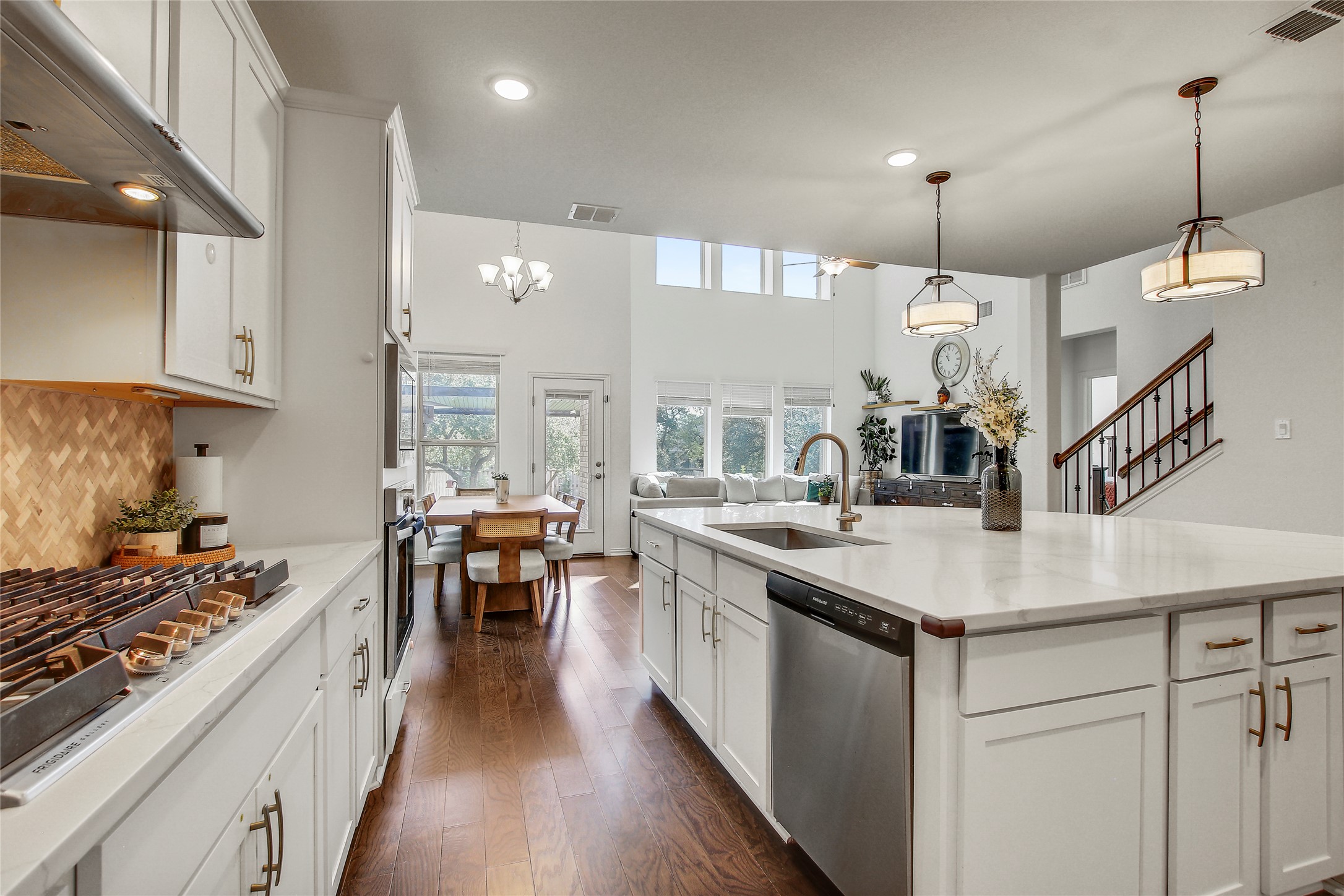 104 Millbend Road Georgetown, TX 78633 - Photo 12 of 40 A gourmet kitchen with an expansive island flows into an airy living space, perfect for entertaining.
