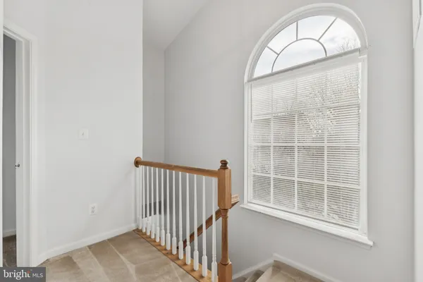 workspace with wooden floor and windows