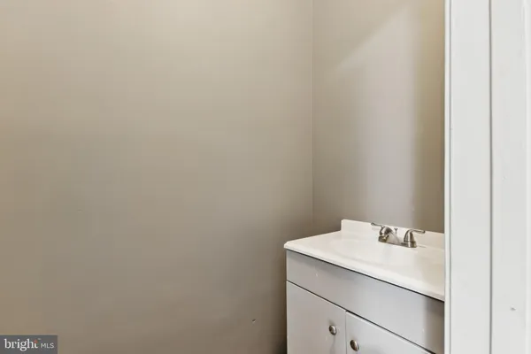 a bathroom with a sink and vanity