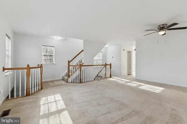 a view of an empty room with stairs