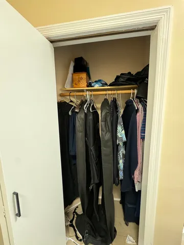 a view of workspace with wooden wall chairs and windows