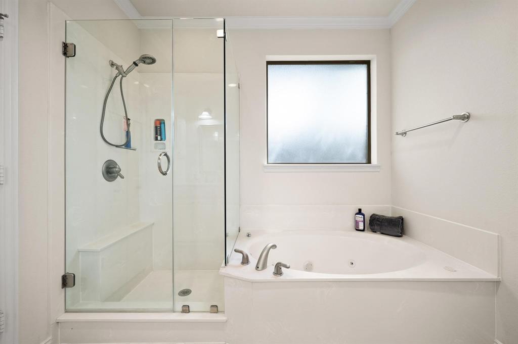 4209 Sexton Lane Dallas, TX 75229 - Photo 15 of 27 a bathroom with a bath tub and shower