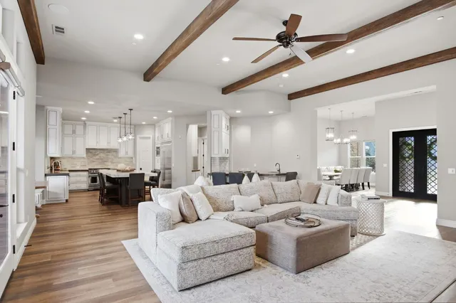 a living room with fireplace furniture and a flat screen tv