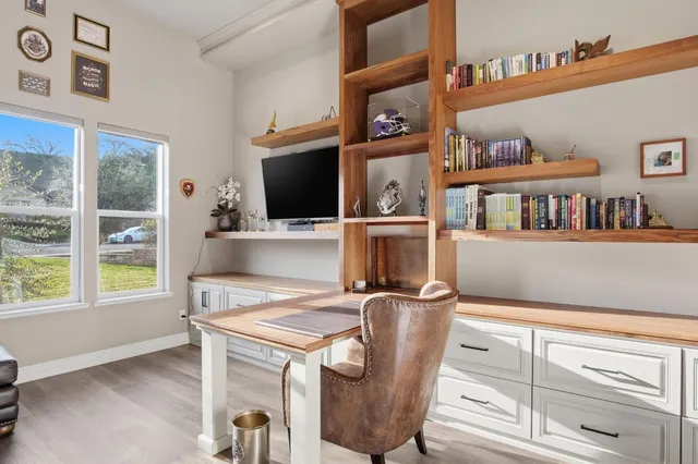 a bathroom with a double vanity sink a mirror and a bathtub
