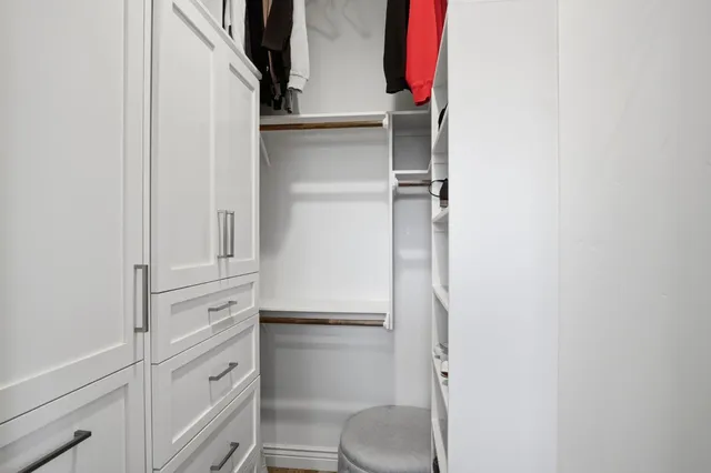 a view of swimming pool with outdoor seating and a garden