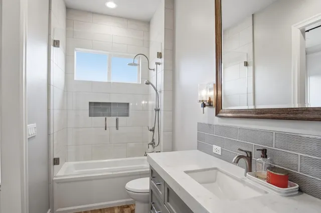 a backyard of a house with table and chairs