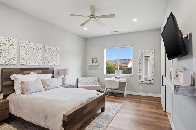 a view of a house with swimming pool and sitting area