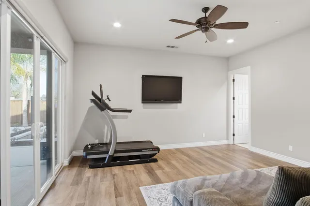 a living room with furniture fireplace and a flat screen tv