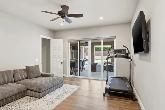 a view of a roof deck with wooden floor and fence with a wooden fence