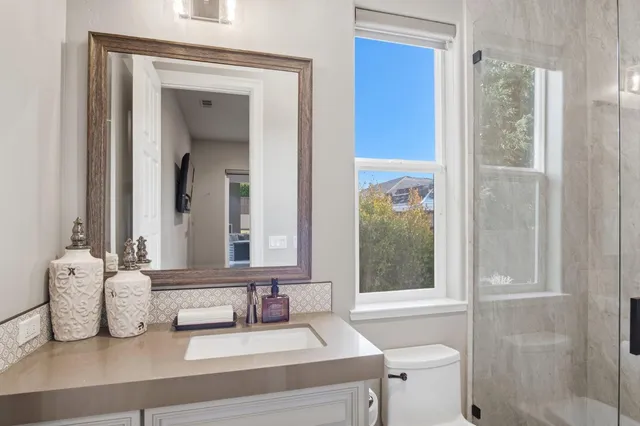 a view of swimming pool with outdoor seating and a garden
