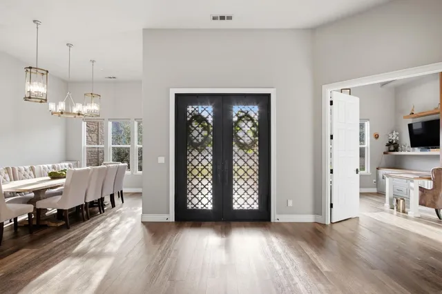 a view of a room with gym equipment and windows