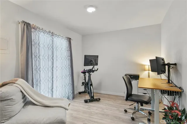 a view of a workspace with furniture and lounge chair