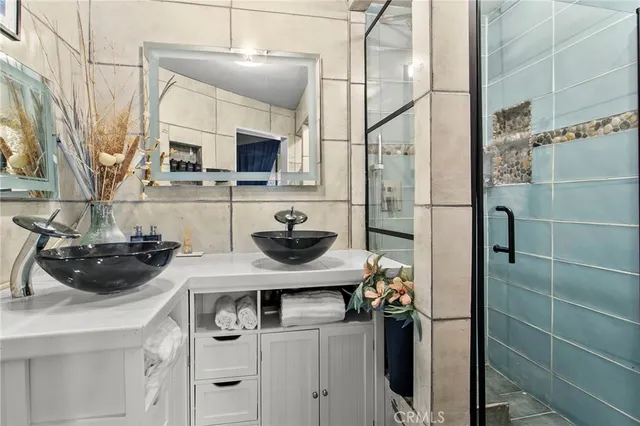 a kitchen with a sink appliances and cabinets