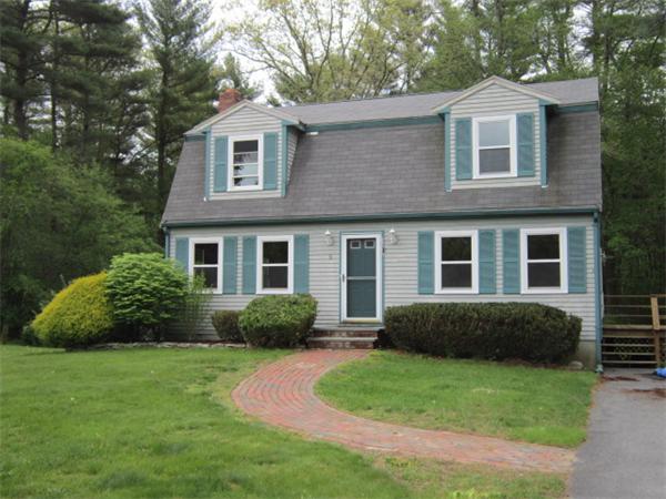 9 Halcyon Farm Road Lakeville, MA 02347 - Photo 2 of 13 a front view of a house with a garden