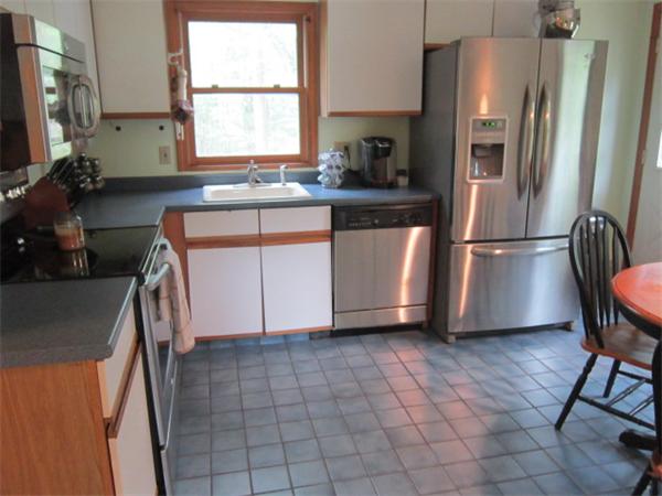 9 Halcyon Farm Road Lakeville, MA 02347 - Photo 6 of 13 a kitchen with a sink a refrigerator and window