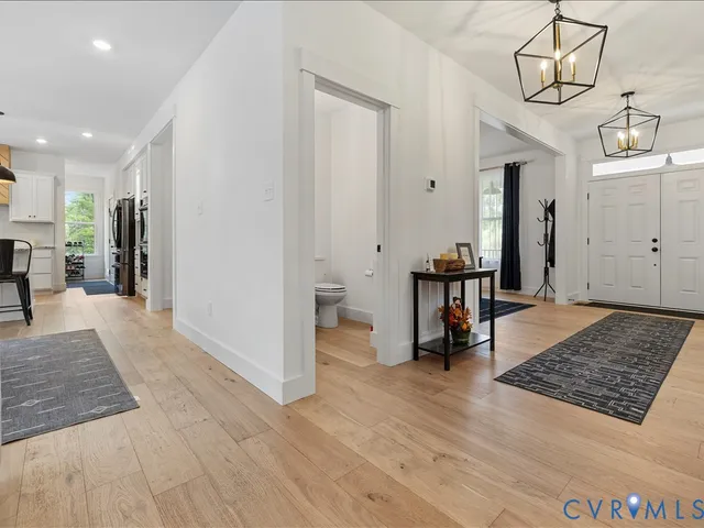 a bed sitting in a spacious bedroom next to a window