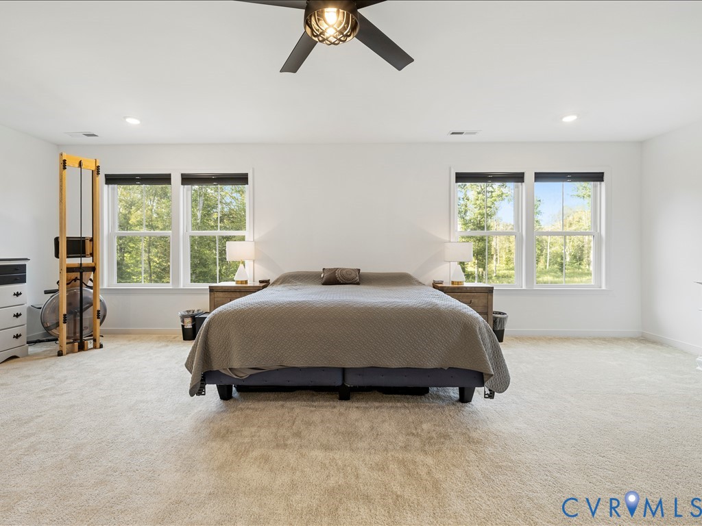 4021 Tredon Road Mechanicsville, VA 23111 - Photo 30 of 50 a bed sitting in a spacious bedroom next to a window