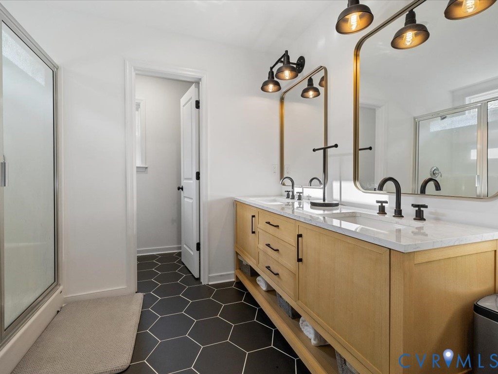 4021 Tredon Road Mechanicsville, VA 23111 - Photo 32 of 50 a spacious bathroom with a double vanity sink mirror and