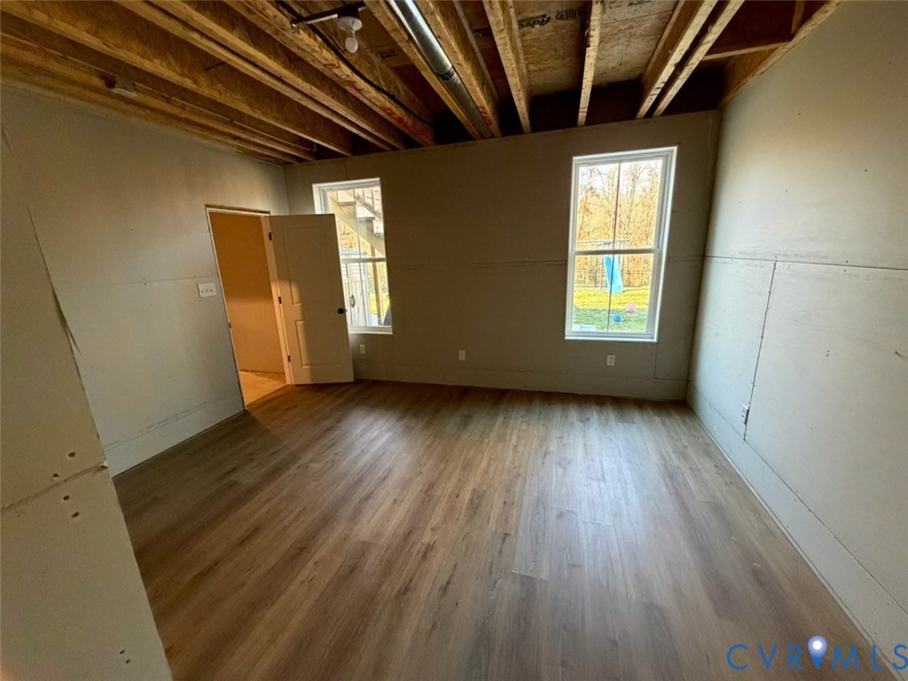 4021 Tredon Road Mechanicsville, VA 23111 - Photo 35 of 50 an empty room with wooden floor and windows