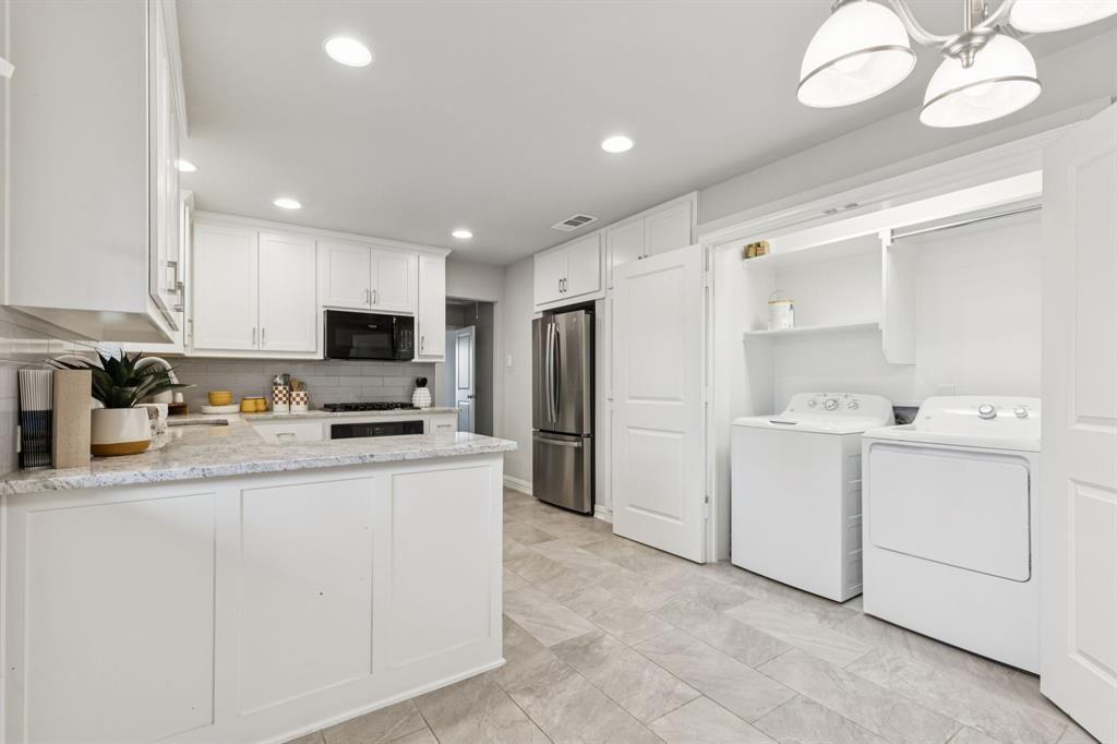 9363 Angora Street Dallas, TX 75218 - Photo 4 of 10 a kitchen with cabinets and stainless steel appliances