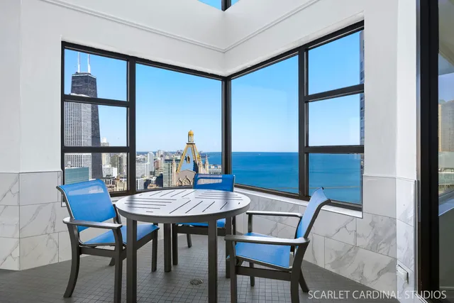 a view of a dining room with furniture and window