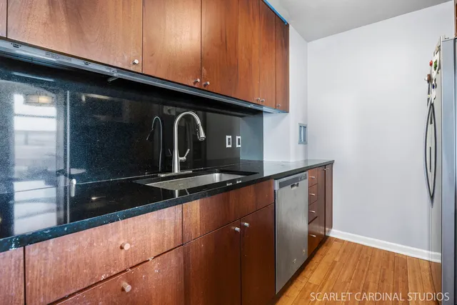 a kitchen with granite countertop cabinets and a sink