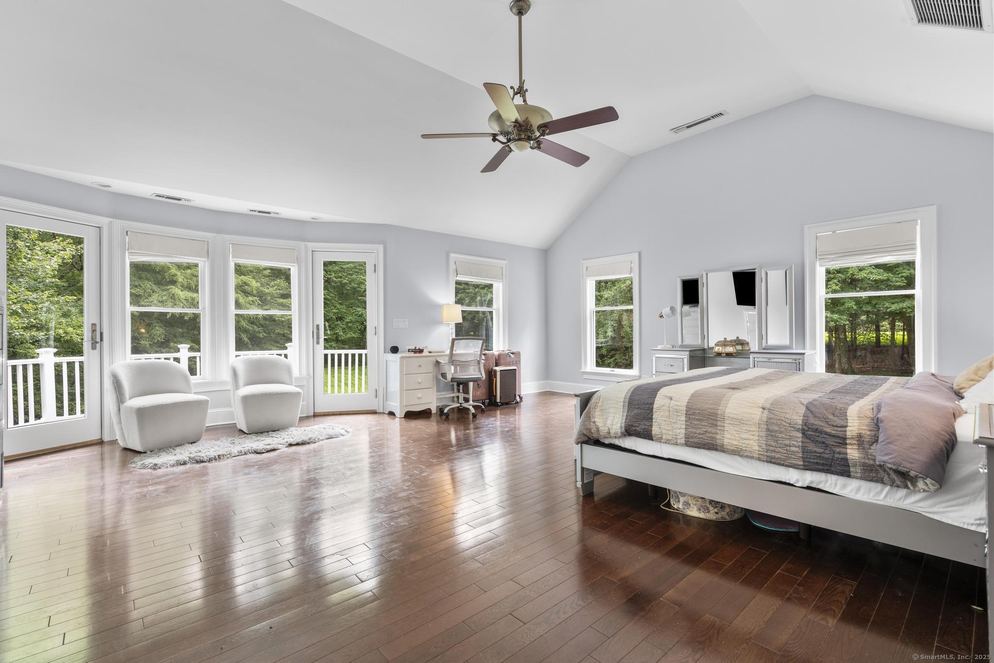 101 Brambly Hedge Circle Fairfield, CT 06824 - Photo 19 of 40 a bed sitting in a spacious bedroom next to a large window