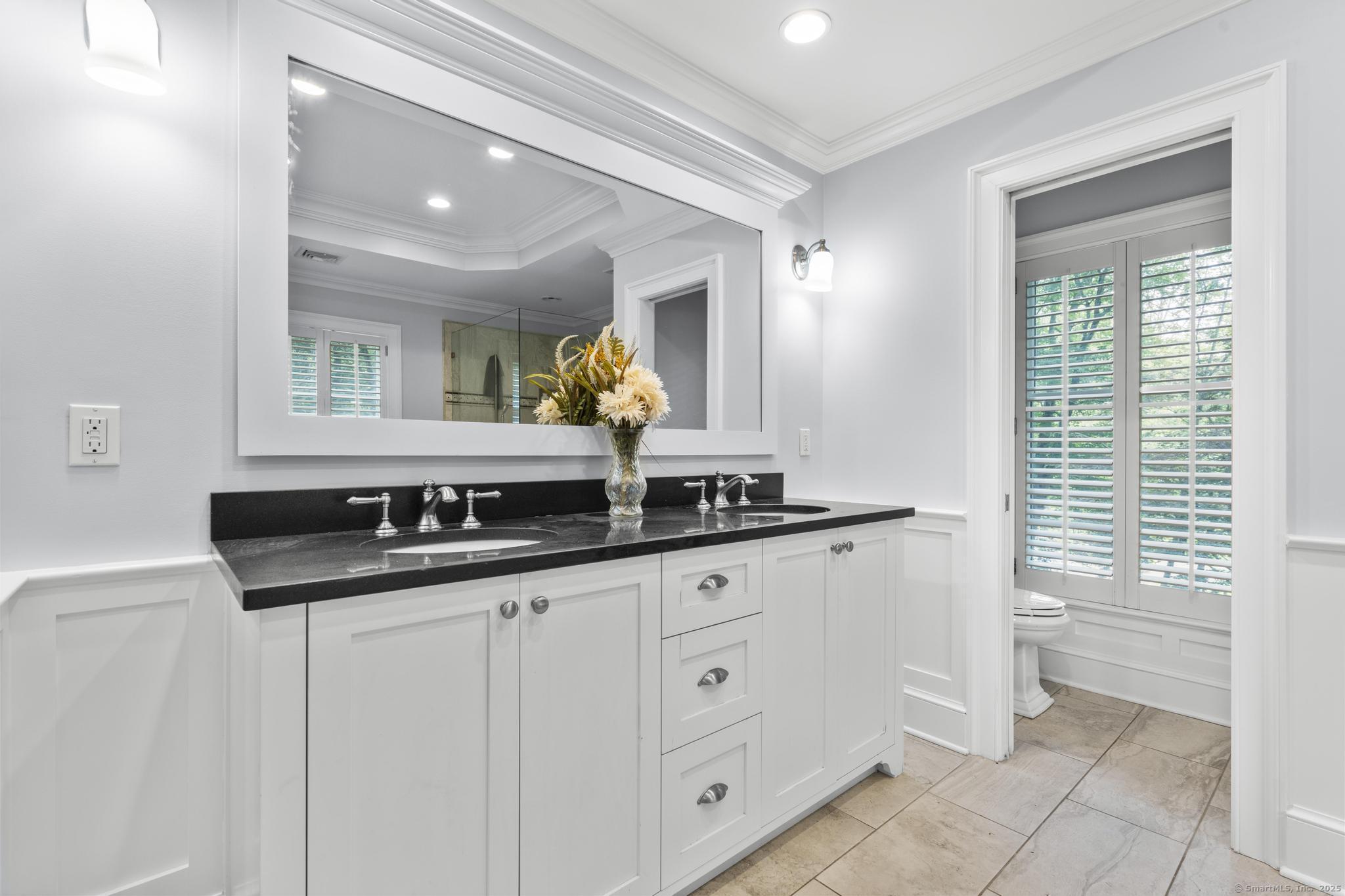 101 Brambly Hedge Circle Fairfield, CT 06824 - Photo 21 of 40 a bathroom with a sink and a mirror