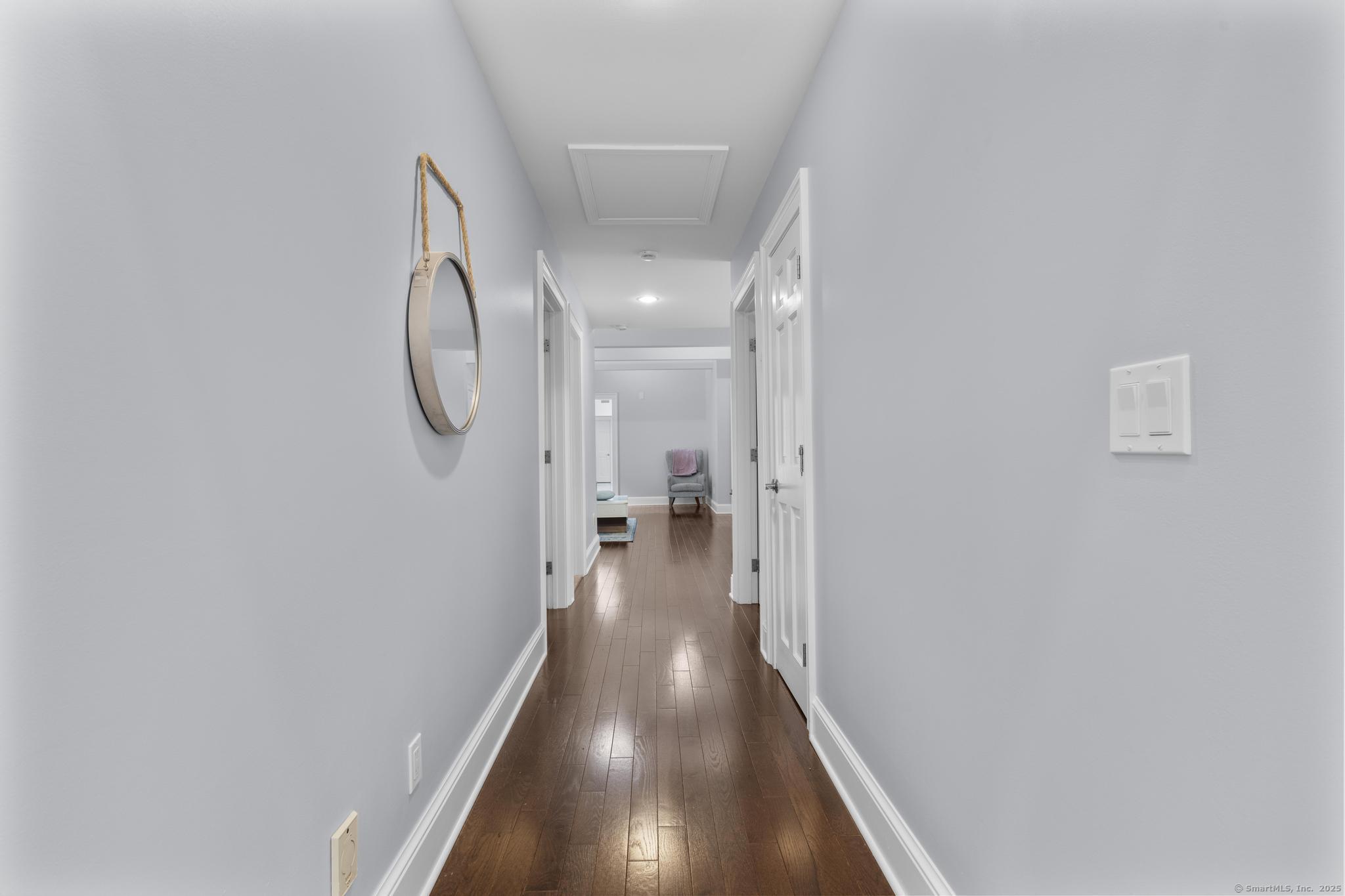 101 Brambly Hedge Circle Fairfield, CT 06824 - Photo 24 of 40 a view of a hallway with wooden floor